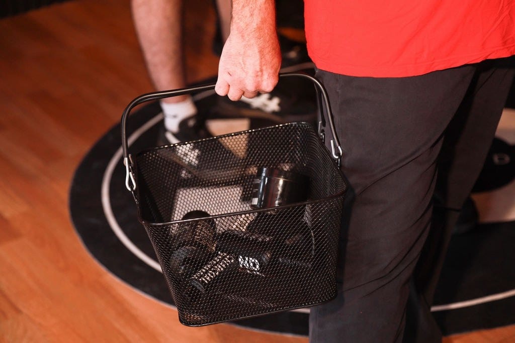 A shopper carrying a basket of LeatherDaddy products on opening day.