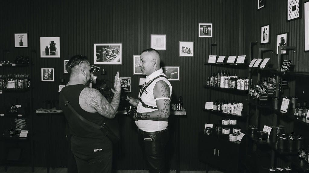 Customers talking in the LeatherDaddy store on opening day.